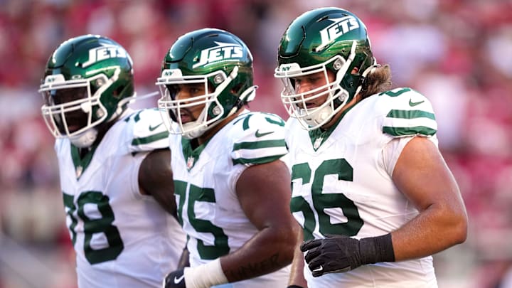 Sep 9, 2024; Santa Clara, California, USA; New York Jets center Joe Tippmann (66) walks to the line of scrimmage with offensive tackle Morgan Moses (left) and guard Alijah Vera-Tucker (center) during the first quarter against the San Francisco 49ers at Levi's Stadium.