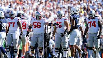 Ohio State Buckeyes offensive linemen, from left, Tegra Tshabola (77), Seth McLaughlin (56), Carson Hinzman (75) and Donovan Jackson (74) line up during the NCAA football game against the Penn State Nittany Lions at Beaver Stadium in University Park, Pa. on Monday, Nov. 4, 2024. Ohio State won 20-13.