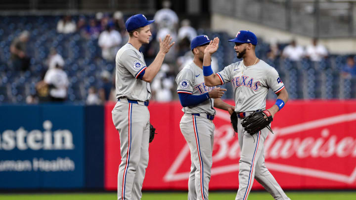 Aug 10, 2024; Bronx, New York, USA; Texas Rangers outfielder Leody Taveras (3) high fives teammates after winning against the New York Yankees at Yankee Stadium. Mandatory Credit: John Jones-USA TODAY Sports