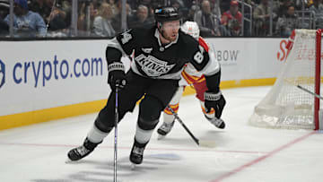 Apr 17, 2025; Los Angeles, California, USA;  Los Angeles Kings defenseman Vladislav Gavrikov (84) controls the puck during the second period at Crypto.com Arena. Mandatory Credit: Jayne Kamin-Oncea-Imagn Images