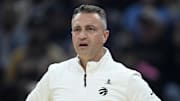 Toronto Raptors head coach Darko Rajakovic reacts in the first quarter against the Cleveland Cavaliers.