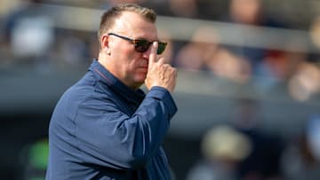 Oct 4, 2025; West Lafayette, Indiana, USA; Illinois Fighting Illini head coach Bret Bielema watches warm-ups before the game against the Purdue Boilermakers at Ross-Ade Stadium. 