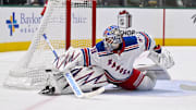 Dec 20, 2024; Dallas, Texas, USA; New York Rangers goaltender Igor Shesterkin (31) makes a save on a Dallas Stars shot during the second period at the American Airlines Center. Mandatory Credit: Jerome Miron-Imagn Images