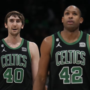 Jan 16, 2023; Charlotte, North Carolina, USA; Boston Celtics center Luke Kornet (40) and center Al Horford (42) walk off the court during a time out during the second quarter against the Charlotte Hornets at Spectrum Center. Mandatory Credit: Jim Dedmon-USA TODAY Sports