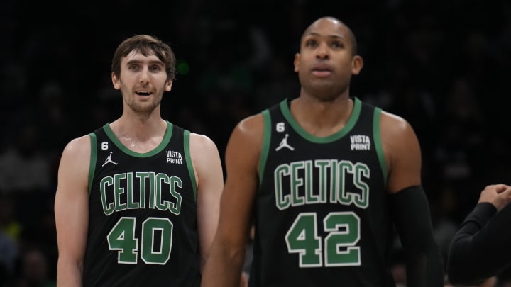 Jan 16, 2023; Charlotte, North Carolina, USA; Boston Celtics center Luke Kornet (40) and center Al Horford (42) walk off the court during a time out during the second quarter against the Charlotte Hornets at Spectrum Center. Mandatory Credit: Jim Dedmon-USA TODAY Sports