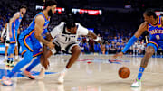 Minnesota Timberwolves center Naz Reid and Oklahoma City Thunder forward Jalen Williams (8) go for the ball during the second quarter in Game 5 of the Western Conference finals at Paycom Center in Oklahoma City on May 28, 2025.