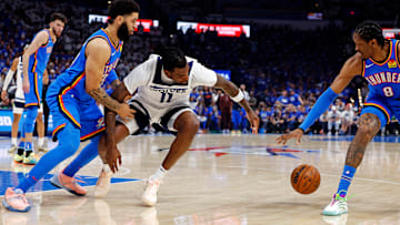 Minnesota Timberwolves center Naz Reid and Oklahoma City Thunder forward Jalen Williams (8) go for the ball during the second quarter in Game 5 of the Western Conference finals at Paycom Center in Oklahoma City on May 28, 2025.