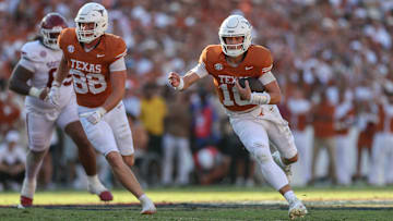 Texas Longhorns quarterback Arch Manning scrambles during his team's 23-6 Week 8 victory over the No. 6 Oklahoma Sooners.