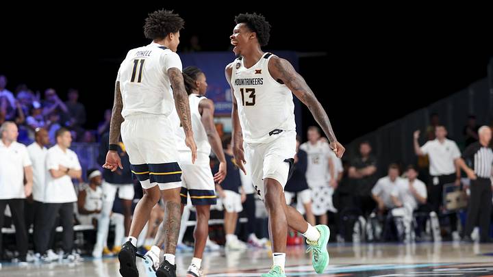 Nov 27, 2024; Paradise Island, Bahamas, BHS; West Virginia Mountaineers forward Amani Hansberry (13) celebrates with West Virginia Mountaineers guard Jonathan Powell (11) during overtime against the Gonzaga Bulldogs at the Atlantis Resort.  Mandatory Credit: Kevin Jairaj-Imagn Images