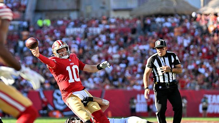 San Francisco 49ers quarterback Mac Jones (10) tackled by Tampa Bay Buccaneers linebacker Anthony Nelson (98)