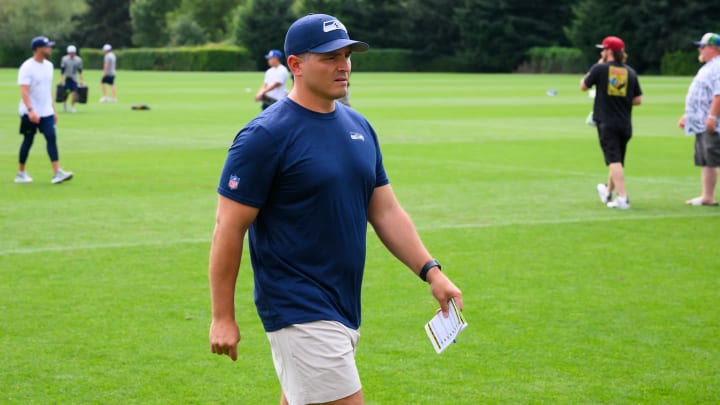 Jul 27, 2024; Renton, WA, USA; Seattle Seahawks head coach Michael Macdonald walks off the field after training camp at Virginia Mason Athletic Center. Mandatory Credit: Steven Bisig-USA TODAY Sports