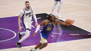 Apr 16, 2024; Sacramento, California, USA; Golden State Warriors forward Kevon Looney (5) chases down a loose ball in front of Sacramento Kings center Alex Len (25) in the third quarter during a play-in game of the 2024 NBA playoffs at the Golden 1 Center. Mandatory Credit: Cary Edmondson-USA TODAY Sports