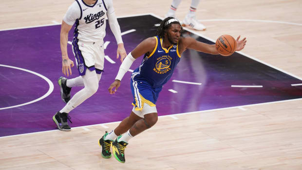 Apr 16, 2024; Sacramento, California, USA; Golden State Warriors forward Kevon Looney (5) chases down a loose ball in front of Sacramento Kings center Alex Len (25) in the third quarter during a play-in game of the 2024 NBA playoffs at the Golden 1 Center. Mandatory Credit: Cary Edmondson-USA TODAY Sports