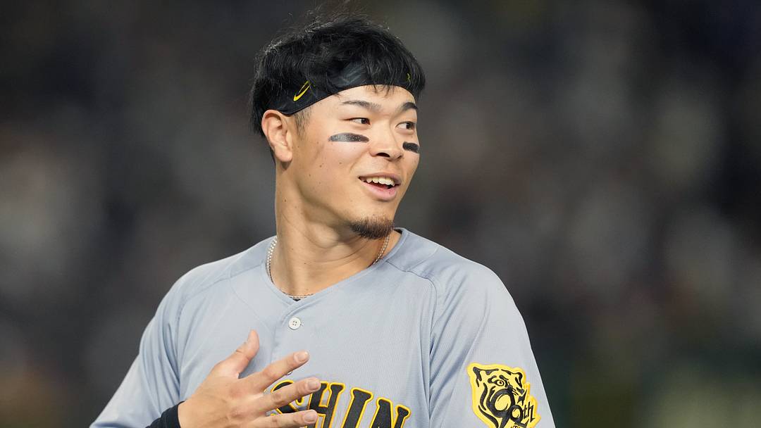 Mar 15, 2025; Bunkyo, Tokyo, Japan; Hanshin Tigers right fielder Teruaki Sato (8) during the fifth inning against the Chicago Cubs at Tokyo Dome. Mandatory Credit: Darren Yamashita-Imagn Images