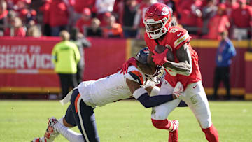 Nov 10, 2024; Kansas City, Missouri, USA; Kansas City Chiefs wide receiver DeAndre Hopkins (8) catches a pass as Denver Broncos cornerback Pat Surtain II (2) attempts the tackle during the first half at GEHA Field at Arrowhead Stadium. Mandatory Credit: Denny Medley-Imagn Images