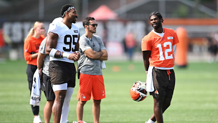 Jul 26, 2025; Berea, OH, USA; Cleveland Browns defensive end Myles Garrett (95) talks to quarterback Shedeur Sanders (12) during training camp at CrossCountry Mortgage Campus. Mandatory Credit: Ken Blaze-Imagn Images