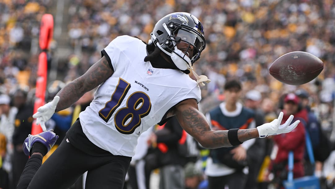 Nov 17, 2024; Pittsburgh, Pennsylvania, USA; Baltimore Ravens wide receiver Diontae Johnson (18) reaches for an incomplete pass against the Pittsburgh Steelers during the first quarter at Acrisure Stadium.
