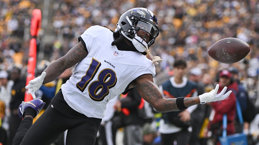 Nov 17, 2024; Pittsburgh, Pennsylvania, USA; Baltimore Ravens wide receiver Diontae Johnson (18) reaches for an incomplete pass against the Pittsburgh Steelers during the first quarter at Acrisure Stadium. Mandatory Credit: Barry Reeger-Imagn Images