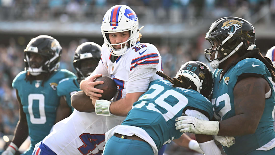 Jan 11, 2026; Jacksonville, FL, USA; Buffalo Bills quarterback Josh Allen (17) runs to score a touchdown during the second half against the Jacksonville Jaguars in an AFC Wild Card Round game at EverBank Stadium.