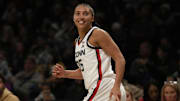 Dec 7, 2024; Brooklyn, New York, USA; Connecticut Huskies guard Azzi Fudd (35) reacts after scoring a three pointer during the first half against the Louisville Cardinals at Barclays Center. Mandatory Credit: Lucas Boland-Imagn Images