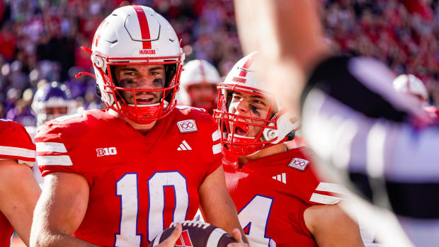 Nebraska Cornhuskers quarterback Heinrich Haarberg (10) and tight end Luke Lindenmeyer (44) celebrate after a touchdown by Ha