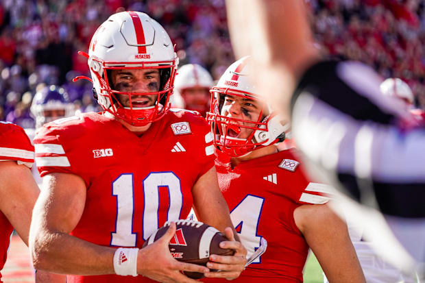 Nebraska Cornhuskers quarterback Heinrich Haarberg and tight end Luke Lindenmeyer celebrate after a touchdown by Haarberg.