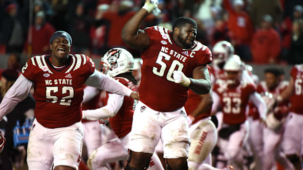 North Carolina State Wolfpack linemen Grant Gibson and Timothy McKay celebrate after beating the North Carolina Tar Heel