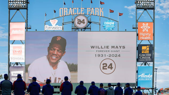 Jun 24, 2024; San Francisco, California, USA; Chicago Cubs players stand during a moment of silence in honor of Willie Mays before the game against San Francisco Giants at Oracle Park. 