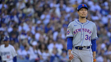 Oct 13, 2024; Los Angeles, California, USA; New York Mets pitcher Kodai Senga (34) reacts against the Los Angeles Dodgers during the first inning in game one of the NLCS for the 2024 MLB Playoffs at Dodger Stadium. Mandatory Credit: Jayne Kamin-Oncea-Imagn Images