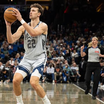Mar 27, 2025; Orlando, Florida, USA; Orlando Magic forward Franz Wagner (22) shoots a three against the Dallas Mavericks in the fourth quarter at Kia Center. Mandatory Credit: Jeremy Reper-Imagn Images