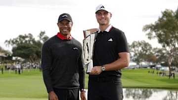 Ludvig Aberg poses with tournament host Tiger Woods after winning the 2025 edition of The Genesis Invitational