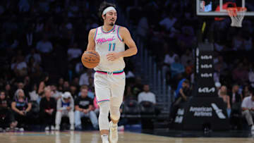Apr 7, 2025; Miami, Florida, USA; Miami Heat guard Jaime Jaquez Jr. (11) dribbles the basketball against the Philadelphia 76ers during the second quarter at Kaseya Center. Mandatory Credit: Sam Navarro-Imagn Images