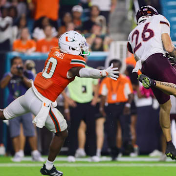 Virginia Tech wide receiver Ayden Greene (26) catches the football for a touchdown against Miami defensive back Mishael Powell (0).
