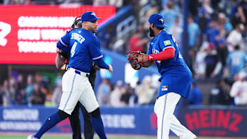 Toronto Blue Jays first baseman Vladimir Guerrero Jr. (right) celebrates a win with right fielder George Springer. 