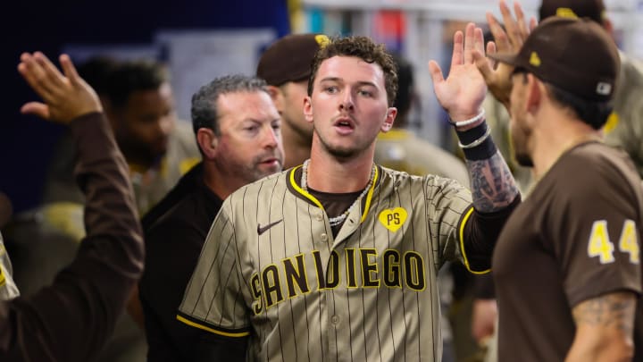 Aug 11, 2024; Miami, Florida, USA; San Diego Padres center fielder Jackson Merrill (3) celebrates after scoring against the Miami Marlins during the seventh inning at loanDepot Park. Mandatory Credit: Sam Navarro-USA TODAY Sports