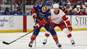 Apr 1, 2025; St. Louis, Missouri, USA; Detroit Red Wings defenseman Ben Chiarot (8) pressures St. Louis Blues center Dylan Holloway (81) during the first period at Enterprise Center. Mandatory Credit: Jeff Le-Imagn Images