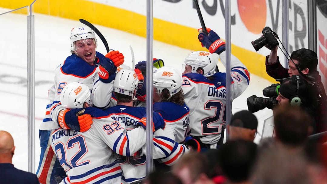 May 14, 2025; Las Vegas, Nevada, USA; Edmonton Oilers right wing Kasperi Kapanen (42) celebrates with team mates after scoring a game-winning goal against the Vegas Golden Knights in overtime to give the Oilers a 1-0 victory in the game and a 4-1 series win during game five of the second round of the 2025 Stanley Cup Playoffs at T-Mobile Arena. Mandatory Credit: Stephen R. Sylvanie-Imagn Images