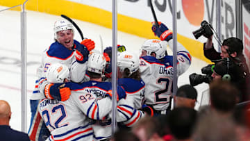 May 14, 2025; Las Vegas, Nevada, USA; Edmonton Oilers right wing Kasperi Kapanen (42) celebrates with team mates after scoring a game-winning goal against the Vegas Golden Knights in overtime to give the Oilers a 1-0 victory in the game and a 4-1 series win during game five of the second round of the 2025 Stanley Cup Playoffs at T-Mobile Arena. Mandatory Credit: Stephen R. Sylvanie-Imagn Images