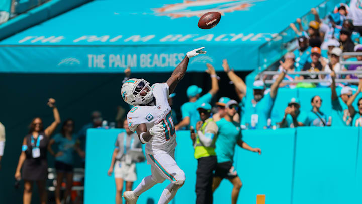 Sep 8, 2024; Miami Gardens, Florida, USA; Miami Dolphins wide receiver Tyreek Hill (10) scores a touchdown against the Jacksonville Jaguars during the third quarter at Hard Rock Stadium.