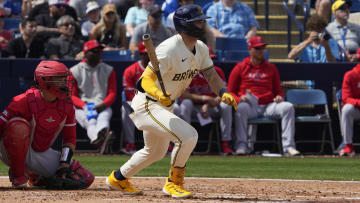 Mar 18, 2024; Phoenix, Arizona, USA; Milwaukee Brewers center fielder Garrett Mitchell (5) hits a single against the Los Angeles Angels in the second inning at American Family Fields of Phoenix. Mandatory Credit: Rick Scuteri-USA TODAY Sports