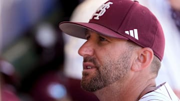 May 21, 2025; Hoover, AL, USA; Mississippi State interim head coach Justin Parker talks to one of his players between innings during the game with Texas A&M in the first round of the SEC Baseball Tournament at the Hoover Met.