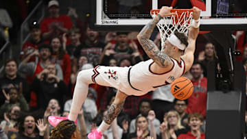 Nov 6, 2025; Louisville, Kentucky, USA;  Louisville Cardinals forward Kasean Pryor (7) dunks against Jackson State Tigers forward Jayme Mitchell Jr. (3) during the first half at KFC Yum! Center. Mandatory Credit: Jamie Rhodes-Imagn Images
