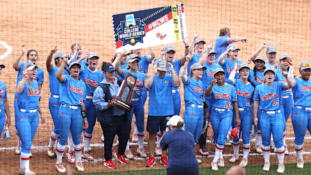 Ole Miss softball celebrates and cheers with their fans after advancing to their first Women's College World Series.