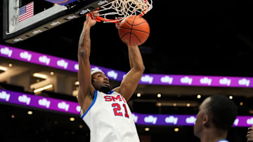 Mar 12, 2025; Charlotte, NC, USA; Southern Methodist Mustangs forward Yohan Traore (21) scores in the first half at Spectrum Center. Mandatory Credit: Bob Donnan-Imagn Images