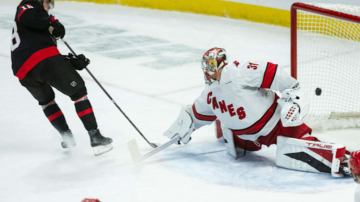 Apr 17, 2025; Ottawa, Ontario, CAN; Ottawa Senators center Tim Stutzle (18) scores against the Carolina Hurricanes goalie Frederik Andersen (31) in the third period at the Canadian Tire Centre. Mandatory Credit: Marc DesRosiers-Imagn Images