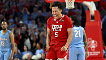 Feb 1, 2025; Houston, Texas, USA; Texas Tech Red Raiders forward Darrion Williams (5) reacts after shooting a three point basket to tie the game with seconds left on the clock against the Houston Cougars at Fertitta Center. Mandatory Credit: Maria Lysaker-Imagn Images 