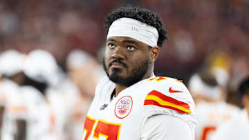 Aug 9, 2025; Glendale, Arizona, USA; Kansas City Chiefs guard Jaylon Moore (77) against the Arizona Cardinals during a preseason NFL game at State Farm Stadium. Mandatory Credit: Mark J. Rebilas-Imagn Images