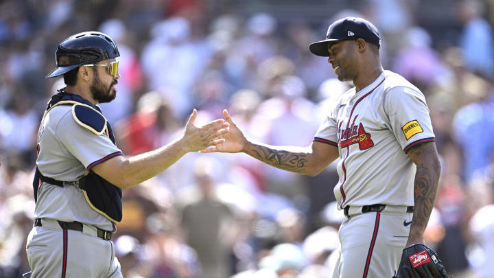 Atlanta Braves catcher Travis d'Arnaud (left) and relief pitcher Raisel Iglesias (26) celebrate on the field after defeating the San Diego Padres at Petco Park on July 14.