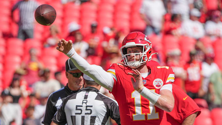 Sep 15, 2024; Kansas City, Missouri, USA; Kansas City Chiefs quarterback Carson Wentz (11) warms up against the Cincinnati Bengals prior to a game at GEHA Field at Arrowhead Stadium.