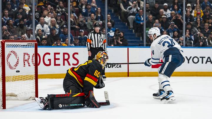Jan 31, 2026; Vancouver, British Columbia, CAN; Toronto Maple Leafs forward Auston Matthews (34) scores on Vancouver Canucks goalie Nikita Tolopilo (60) during the shootout to win the game for the Maple Leafs at Rogers Arena. Mandatory Credit: Bob Frid-Imagn Images